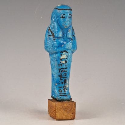 Blue mummy-shaped ushabti with a black inscription...