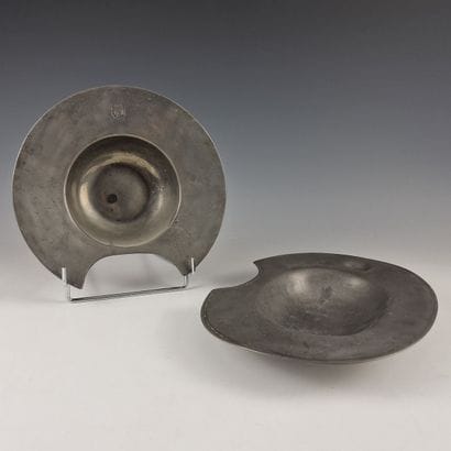 SET OF TWO PEWTER BARBE PLATES: one round...