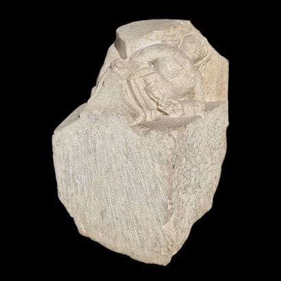 Carved limestone CULOT featuring a bust of...