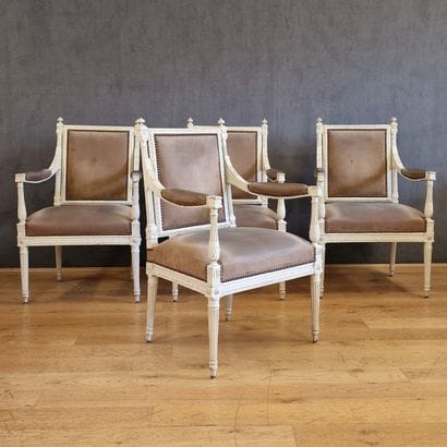 SET OF FOUR ARMCHAIRS with flat rectangular...
