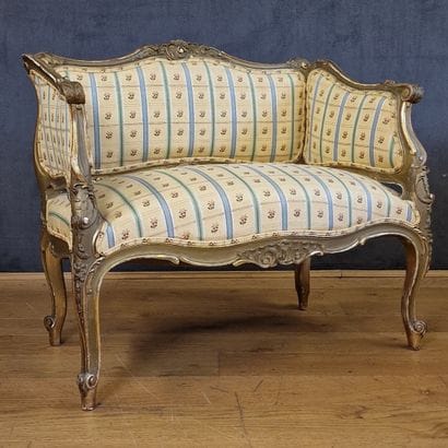LOW MARQUISE CHAIR with a flat, ornate backrest...