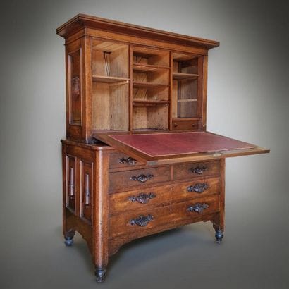 SMALL TWO-PART SCRIBAN DESK with a recessed...