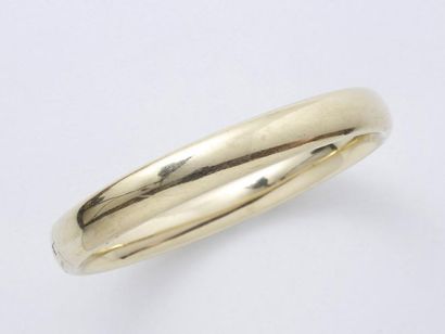 Bracelet jonc rigide ouvrant en or 585 millièmes,...