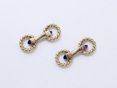 CARTIER

Paire de boutons de manchettes articulés...