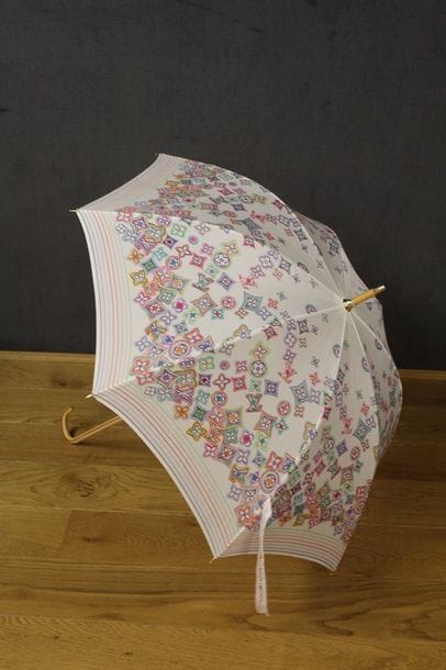 Louis VUITTON 

Parapluie de dame en polyester...