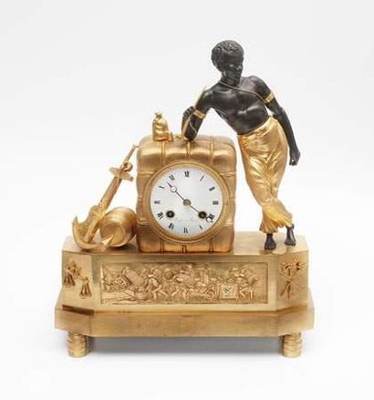 Pendule au nègre à la balle de coton en bronze...