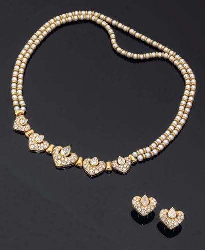 Boucheron. Années 1980
Parure rehaussée de...
