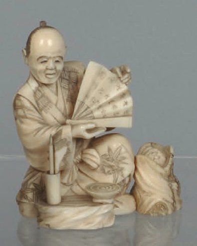 Okimono en ivoire sculpté représentant un...