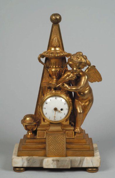Pendulette en bronze doré à cadran émaillé...