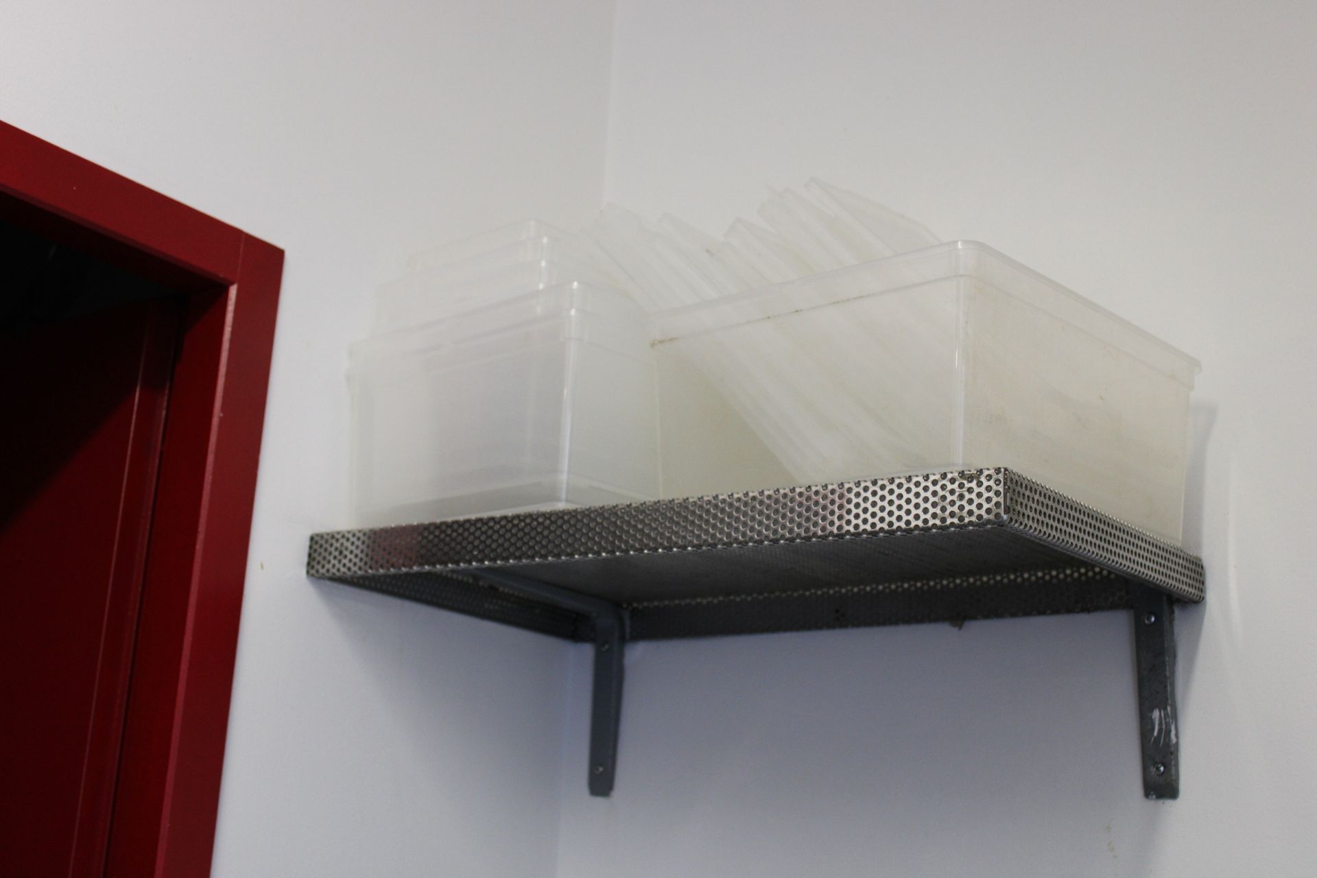 Null Set of seven metal corner shelves with a PVC cabinet.