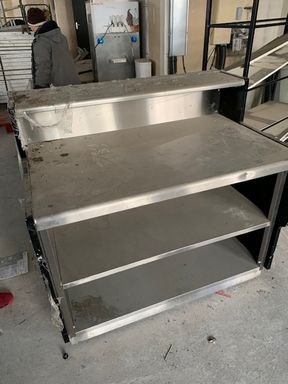 Null Stainless steel base cabinet with shelves.