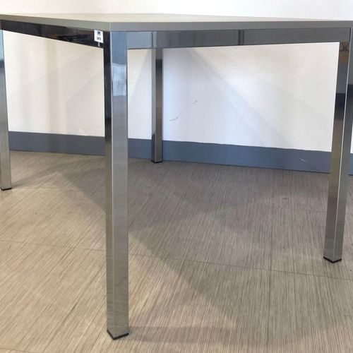 Null TABLE WITH RECTANGULAR TOP IN GRAY LAMINATED WOOD RESTING ON A CHROME STEEL&hellip;